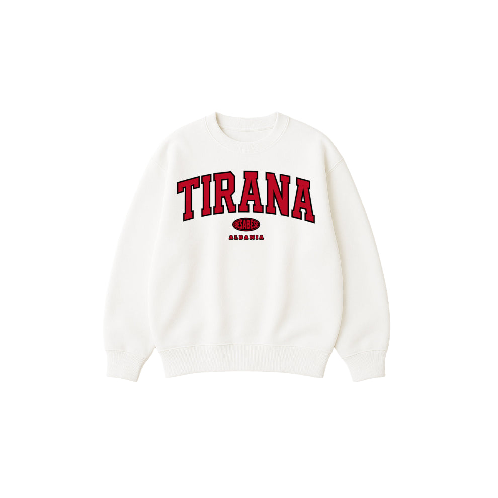 White sweatshirt with 'TIRANA' printed in red on a white background