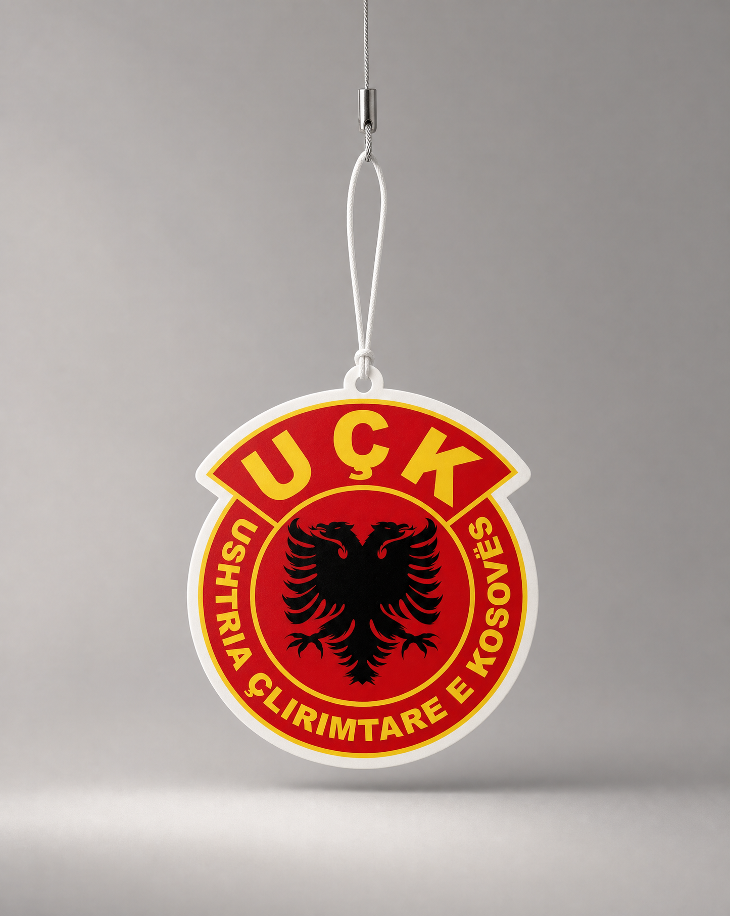 Uşk logo on a red background with a gray background