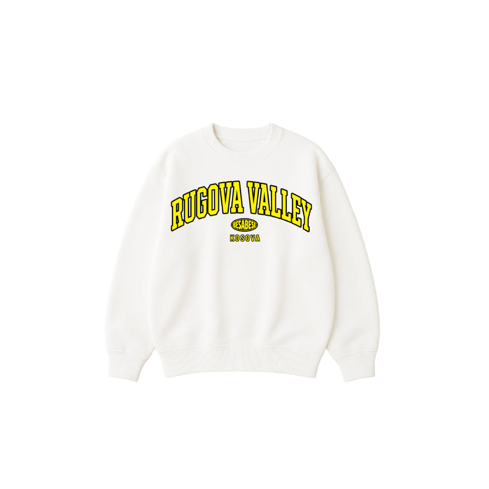White sweatshirt with yellow text 'Rugova Valley' on a white background