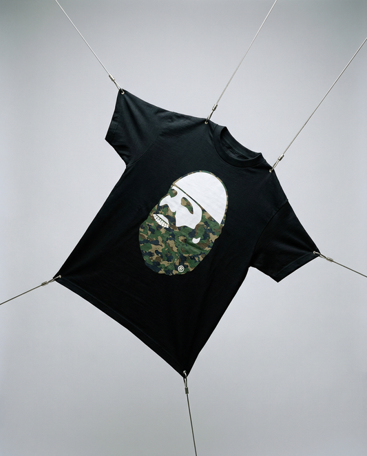 Black t-shirt with a camouflage graphic on a gray background