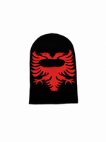 A black knit beanie featuring a bold red embroidered double-headed eagle graphic on the front, set against a plain white background.