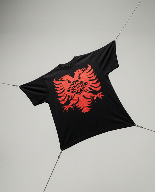Black t-shirt with red eagle design on a white background