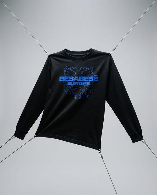 Black long-sleeve shirt with blue graphic design on a gray background