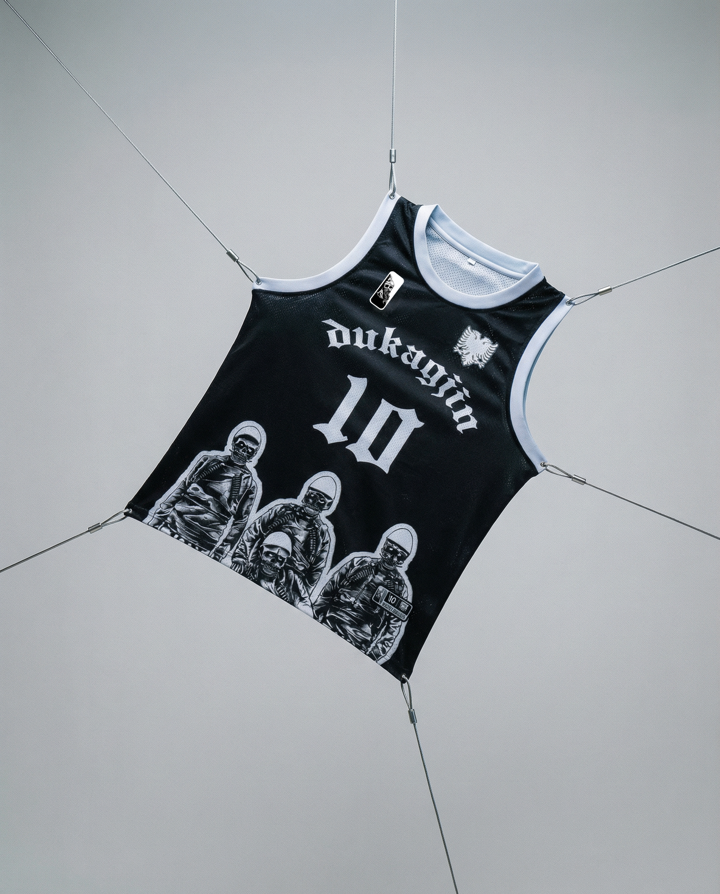 Black tank top with white graphics and text on a gray background