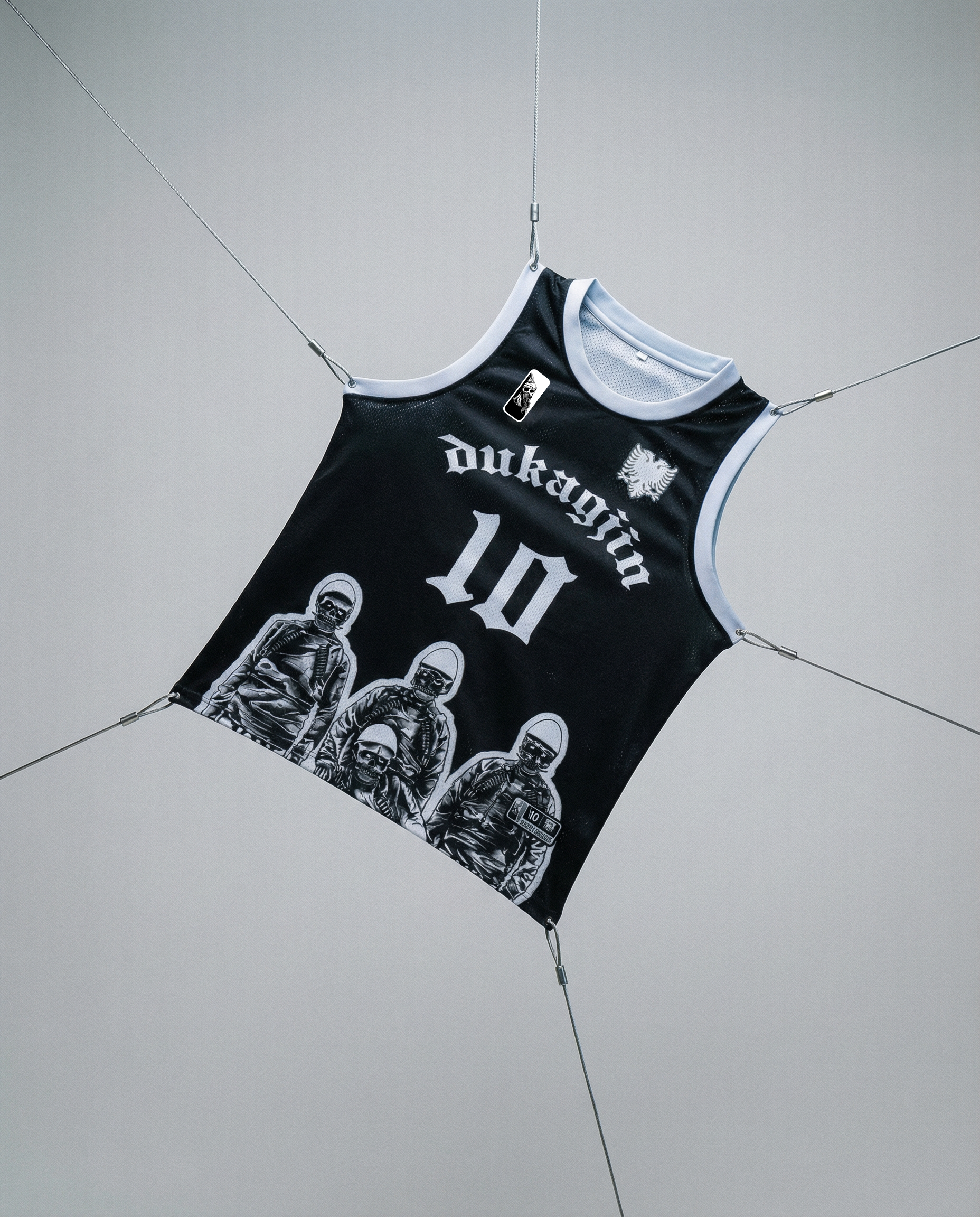 Black tank top with white graphics and text on a gray background
