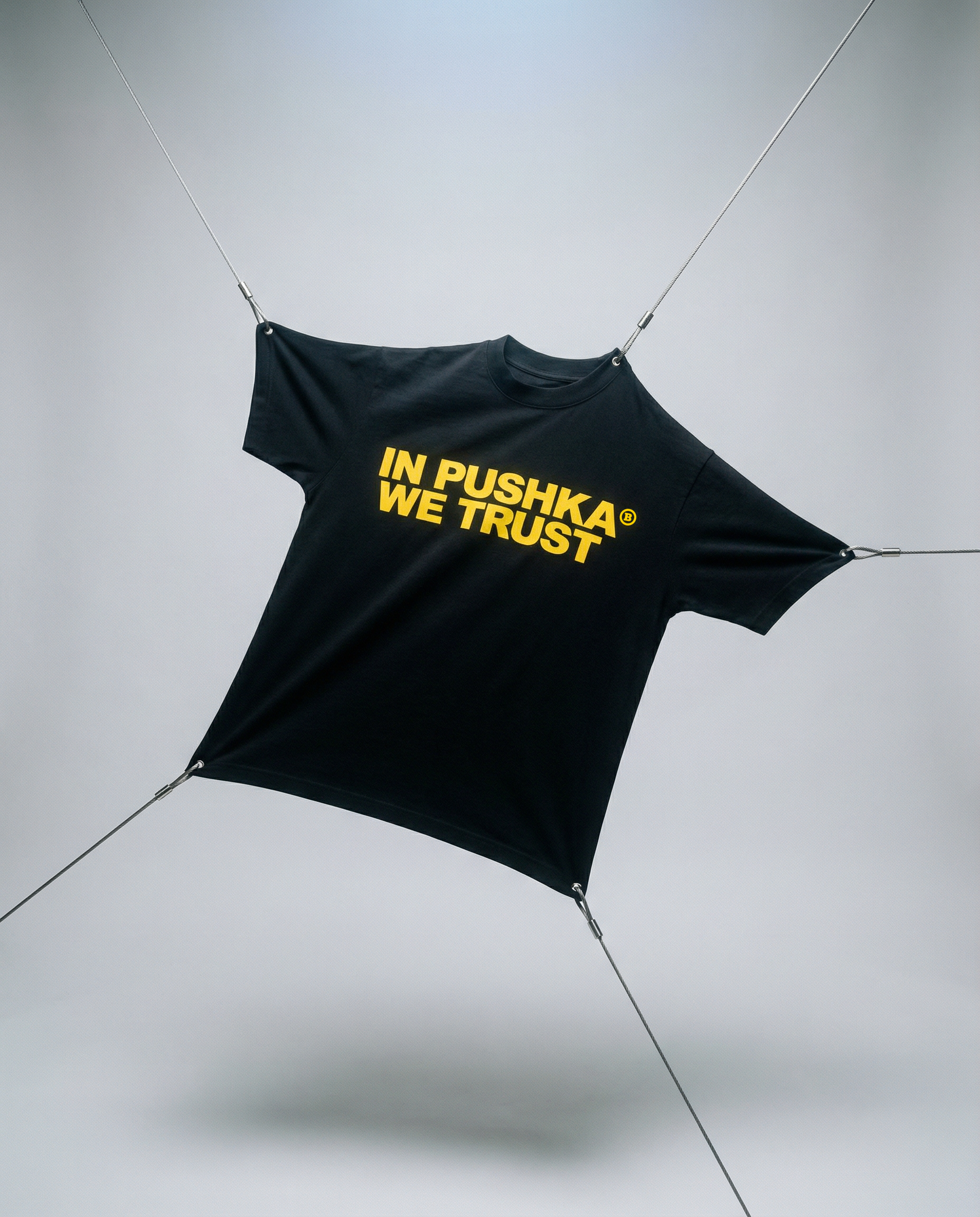Black tarp with 'In Pushka We Trust' text on a gray background