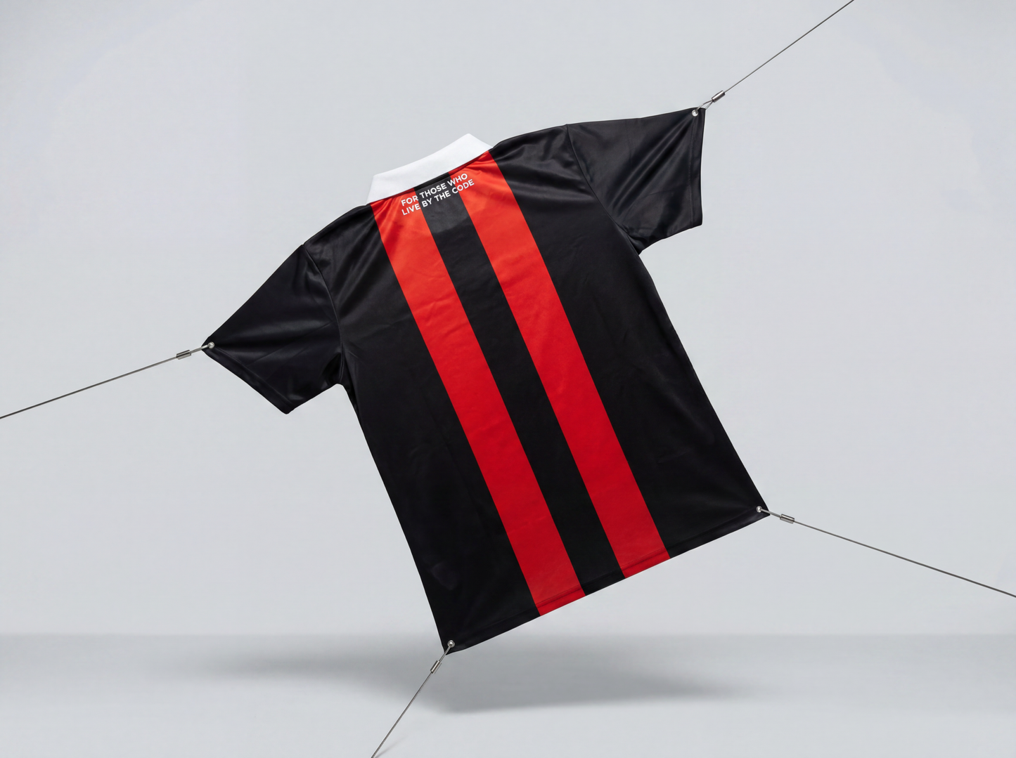 Black and red striped shirt on a light gray background