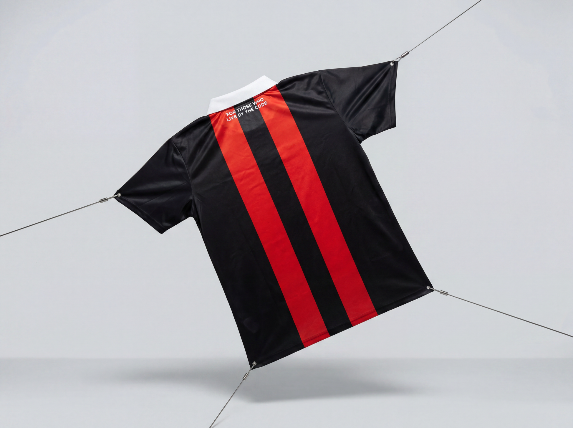Black and red striped shirt on a light gray background