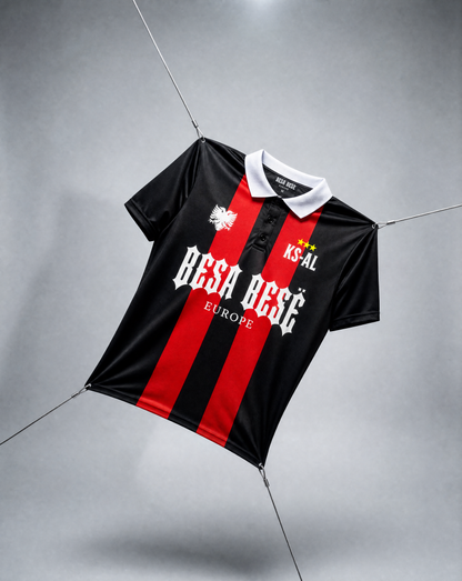 Black and red striped shirt with visible branding on a gray background
