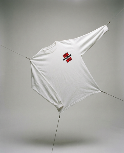 White t-shirt with a red and black logo on a gray background