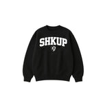 Black sweatshirt with 'SHKUP' text on a white background