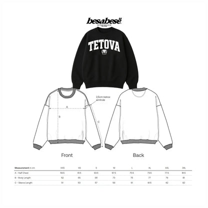 Black sweatshirt with 'TETOVA' branding and measurement chart for sizing on a white background.