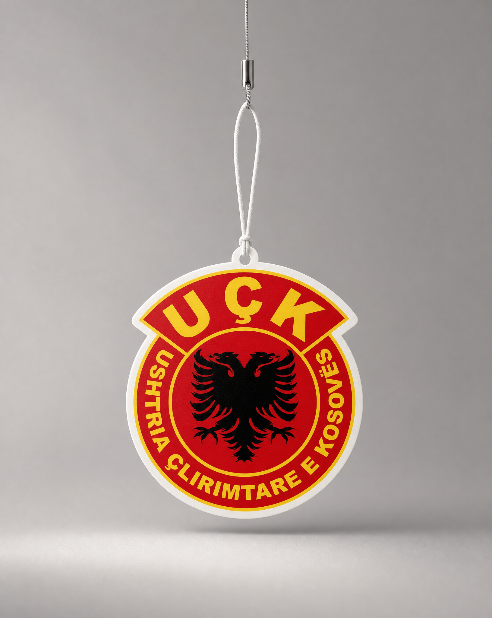 Uşk logo on a red background with a gray background